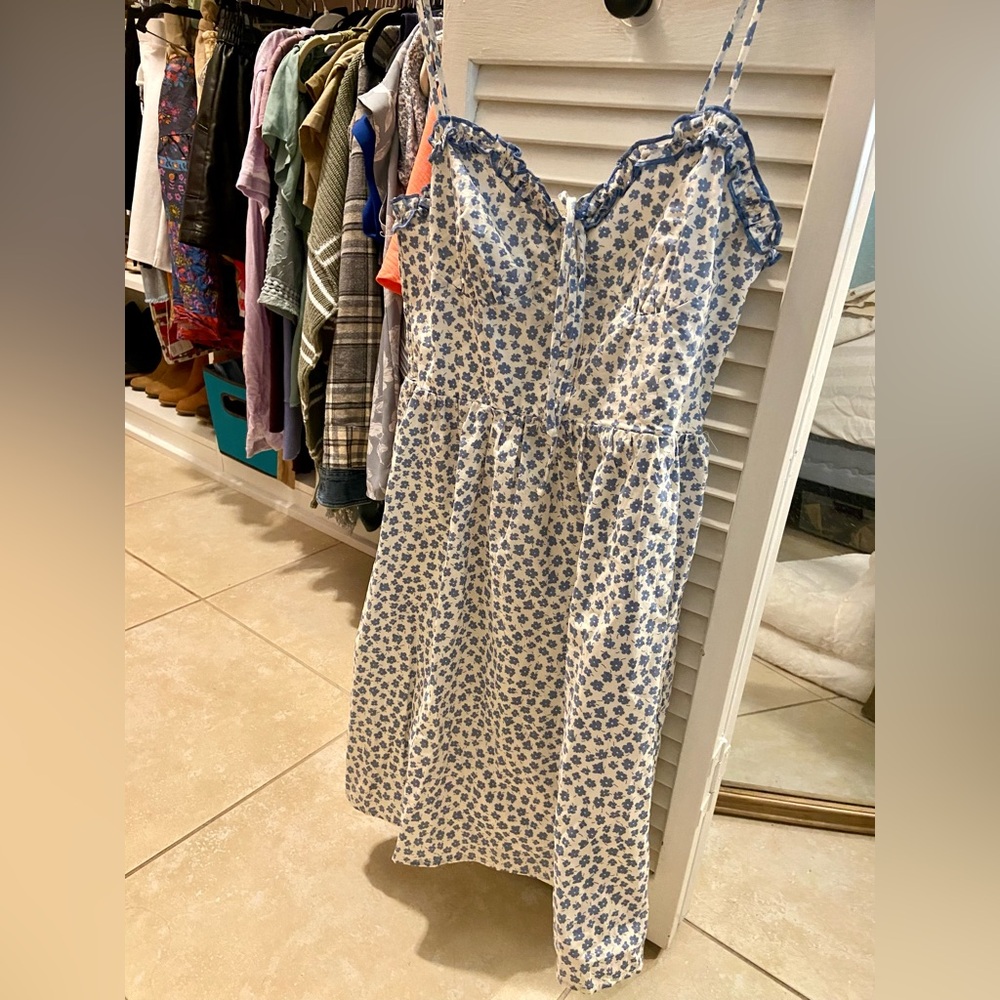 White dress with blue flowers all over